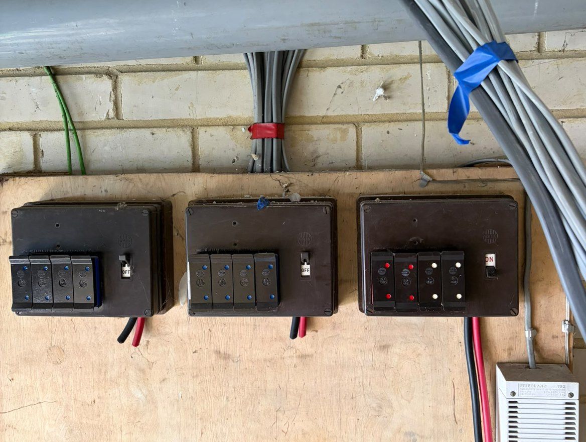Old fuse boxes before a consumer unit change